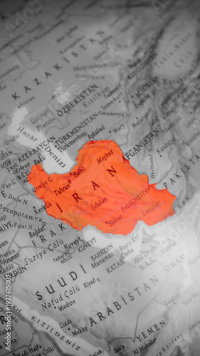 United States and Israel have started a war against Iran. On the world map, Iran is marked in red. The target in war. Political tensions in the Middle East country. World model. Top view.
