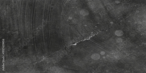 An aged black and white wood texture wall features a delicate spider web pattern over a rough grunge surface with vintage cracks and dirty paint details in a macro backdrop design
