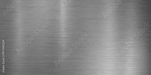 A polished silver stainless steel plate features a brushed metal texture with a shiny industrial gray pattern across the smooth metallic aluminum surface
