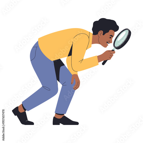 Man searching intently with magnifying glass in hand