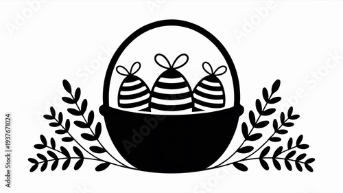 Black basket with three striped easter eggs and leaves on white background symbolizing springtime