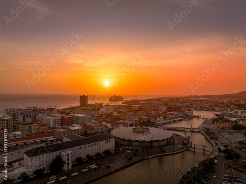 Aerial view of Willemstad port with Cruise ship docked colorful sunset view