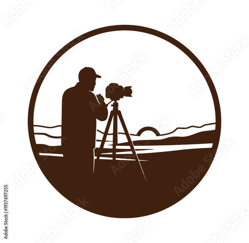 man in cap filming with camera on tripod in front of landscape