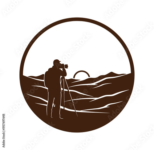 photographer taking picture of landscape with mountains and sunset