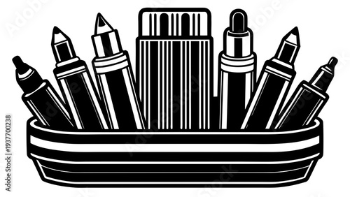 Assorted art markers and pens stand upright in a striped rectangular container against a white.