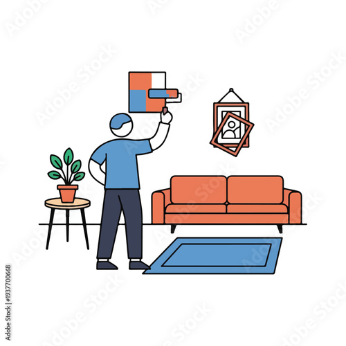Man Hanging Pictures on Wall in Living Room