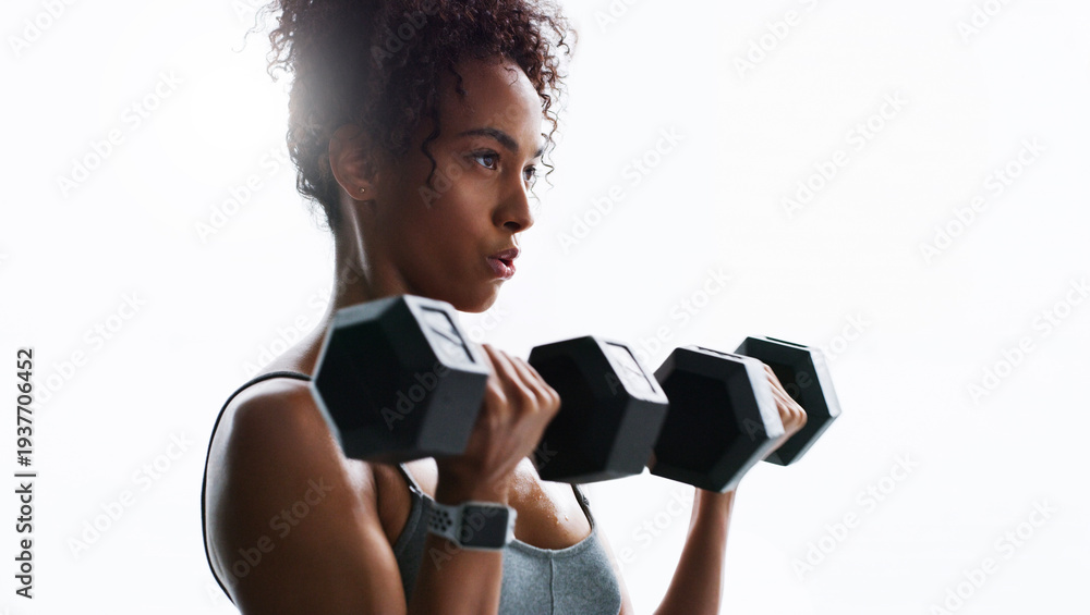 Obraz premium Breathing, dumbbells or woman in gym for fitness, strength challenge or bodybuilding for muscle growth. Flare, concentration or African athlete with weightlifting exercise, serious or training club