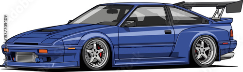 A high-performance blue sports car with a large rear spoiler and custom rims parked on a plain surface from a side view