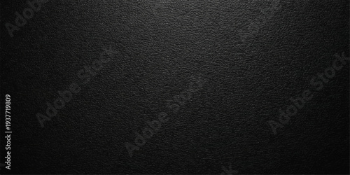 A dark macro pattern of textured black leather material creates a vintage grunge surface background with a rough textile structure