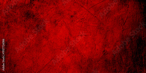 A dark vintage backdrop featuring a textured red grunge paint pattern on an old wooden wall surface creates a dirty decorative design for a Christmas card or artistic wallpaper