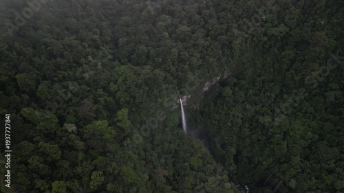 Drone view of Quebrada Gata waterfall on river Rio Toro in Costa Rica near Bajos Del Toro in lush dense misty jungle