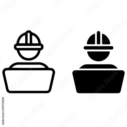 Silhouette of a focused person diligently typing on a laptop computer while seated at a desk illustrating dedication to online work or digital tasks