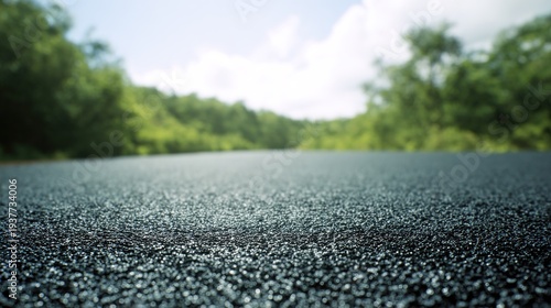 commute. Open road stretching under a bright blue sky, sunlight reflecting on smooth asphalt, evoking endless journeys. mobility guides.