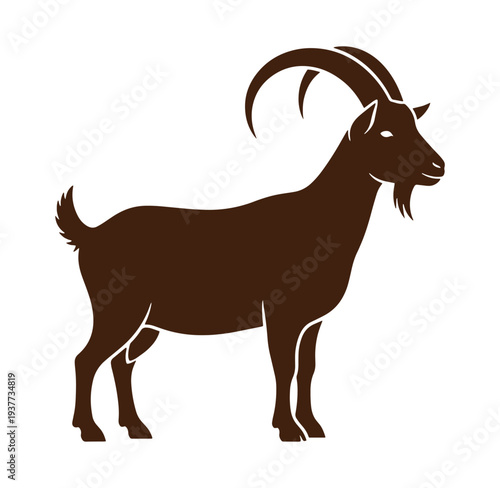 Brown goat standing profile view with curved horns and beard isolated on white background