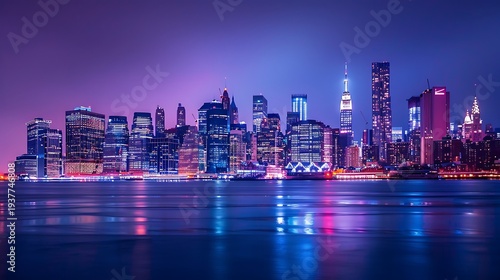 Spectacular view of the illuminated new york city skyline at night featuring towering skyscrapers reflecting vibrant neon colors across the dark tranquil water surface below