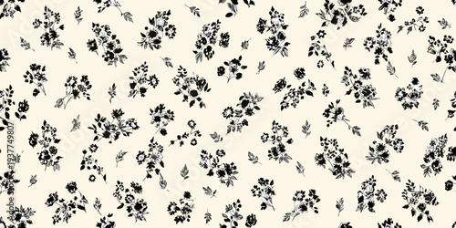Delicate floral pattern with small black blossoms on a cream background