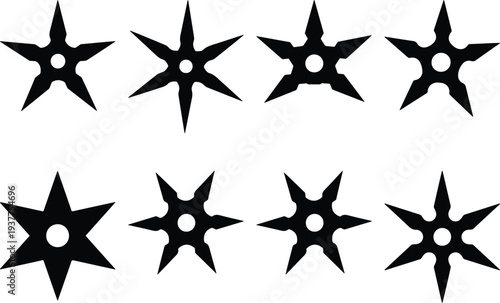 Group of eight black shuriken, or ninja throwing stars, presented as a graphic vector on a white backdrop.