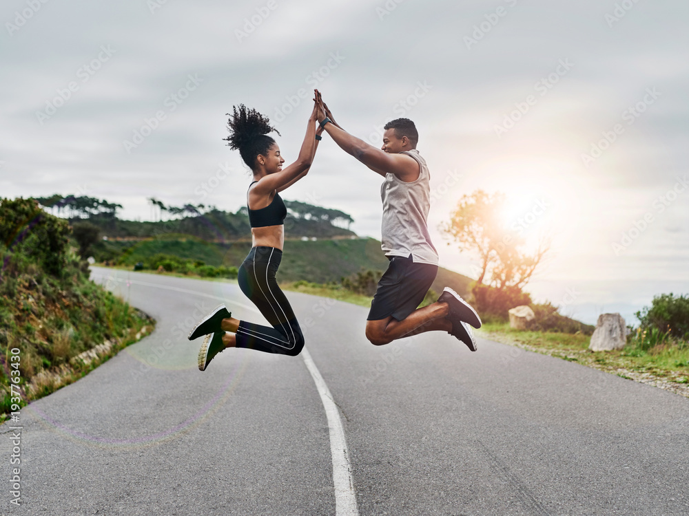 Obraz premium Runner, personal trainer and high five with couple outdoor for fitness club, health and workout partner. Coaching, exercise training and support with man and woman in road for jump, target and energy