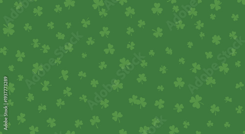Green shamrock pattern seamless backdrop featuring small scattered four leaf clovers