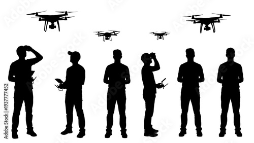 Silhouettes of People Operating Drones in Flight