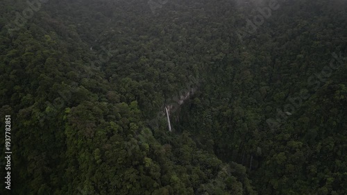 High aerial above hidden waterfall Quebrada Gata in Costa Rica near Bajos del toro