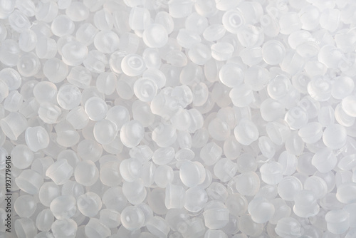 Cuadro en lienzo Translucent plastic pellets fill frame in soft light, clean industrial background for polymer production and recycling themes