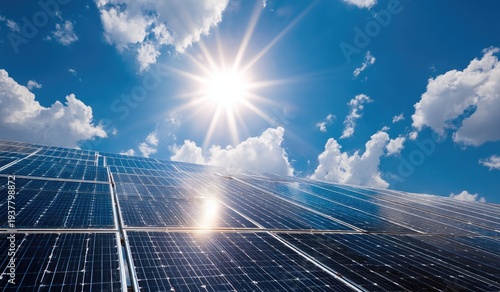 Solar panels bask in the sun's rays under a bright blue sky filled with fluffy white clouds, radiating energy