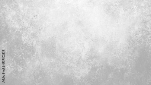 Grey textured background with subtle gradient and speckled pattern