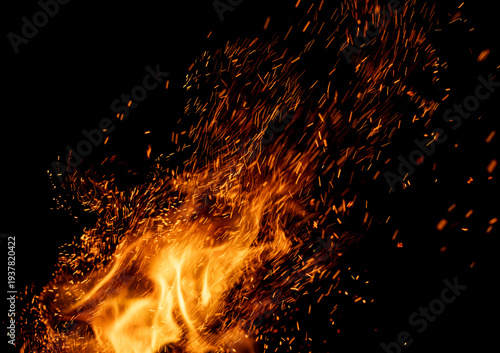 A fire with a lot of sparks flying out of it