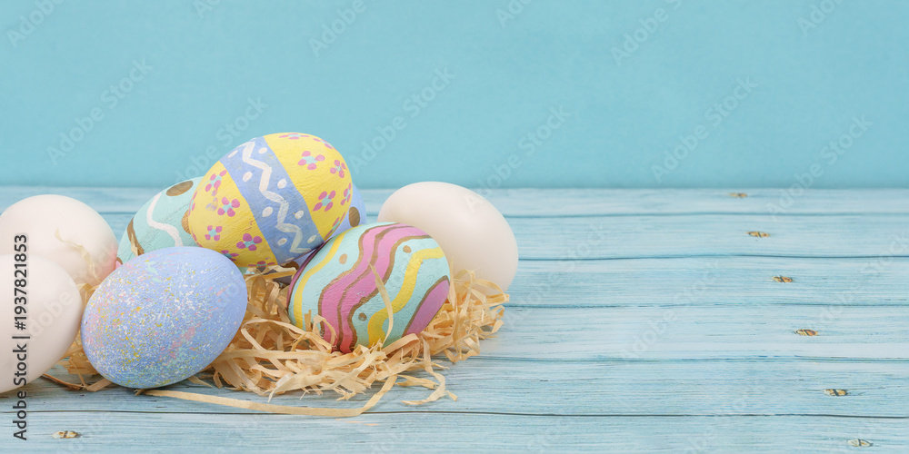 Fototapeta premium Easter eggs and decorations on wooden background