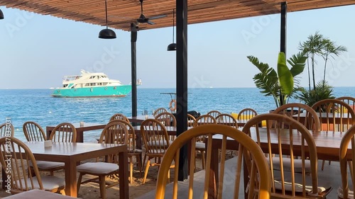 Arabian luxury chic. Expensive Hurghada resort terrace view on a tourist yacht returning from a diving boat trip. All inclusive elite rich lifestyle, Red Sea coral reef cruise, and sunny vacation.