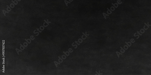 Abstract textured of solid, dark background or surface. Evokes a sense of mystery. Ideal for use as a background or backdrop in graphic design or other creative projects.