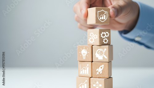 Growth Strategy Visualization: Stacked Wooden Blocks with Arrows, Graphs, and Trophies for Business Success

