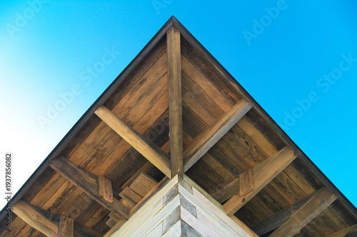 Roofing a wooden house. Rafter system. Roof angle.. facade of an old building