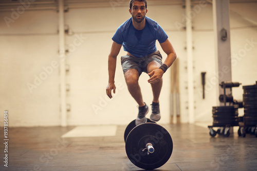 Quadro su tela Fitness, athlete and jump over barbell at gym for burpees exercise, intense cardio or endurance