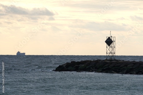 Navigation marker on rocky jetty at Jones Beach State Park in winter