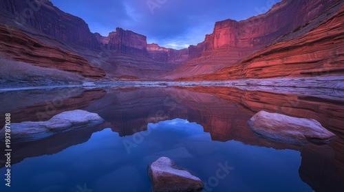 Serene canyon landscape at dusk, showcasing vibrant rock formations and calm water reflection