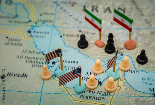Conceptual representation of the geopolitical conflict between Iran and the USA in the Strait of Hormuz, with chess pieces and national flags symbolizing military strategy over oil control