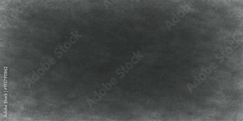 Abstract the image is a striking visual of a textured grey background. The texture is rough and uneven, creating a sense of depth and visual interest. 