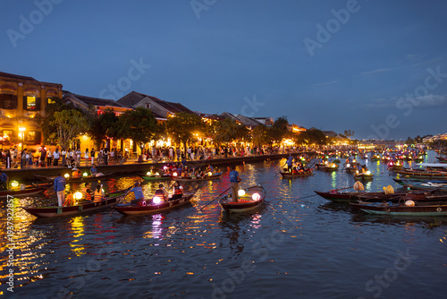 Vibrant Night Scene with Lantern Boats in Hoi An, Vietnam, Ancient Town