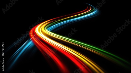 Abstract colorful light trails curving on a dark background, motion blur effect