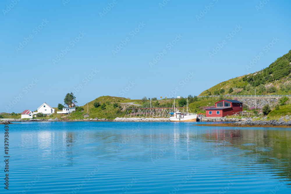 Obraz premium Coastal landscape with a traditional fisherman’s cabin near Ramberg. Lofoten island in Norway.
