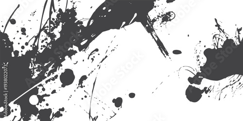Dark grey ink splatters and splashes on white background