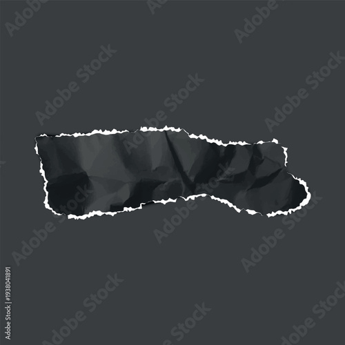 A torn, crumpled strip of black paper with jagged white edges on a dark isolated background.