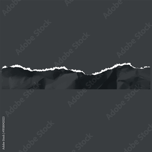 A crumpled piece of torn black paper with a jagged top white edge, on a dark isolated background.