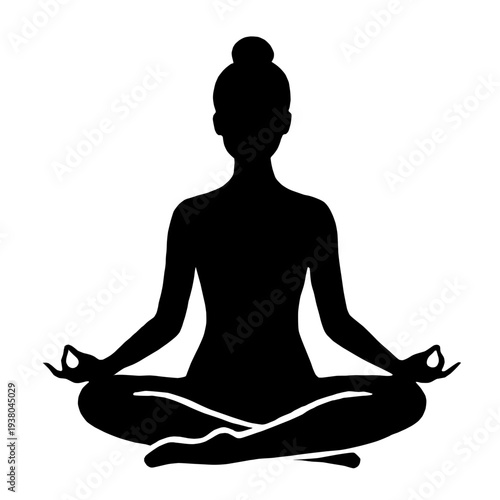 Silhouette of a woman meditating in a lotus position  