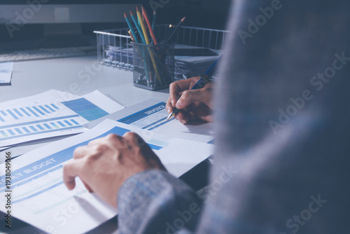 Bild auf Leinwand Professional photo of a person's hands reviewing a contract or legal document on