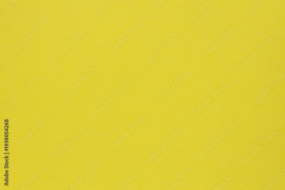 Fototapeta premium Vibrant yellow paper background with smooth color transition for modern design