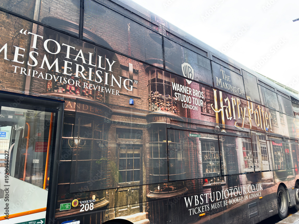 Fototapeta premium Bus wrap advertising for Warner Bros Studio Tour London Harry Potter experience in London UK