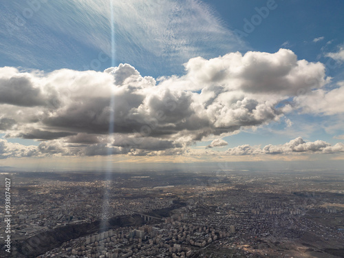 Photography Cityscape from above with dynamic cloud formations and natural light